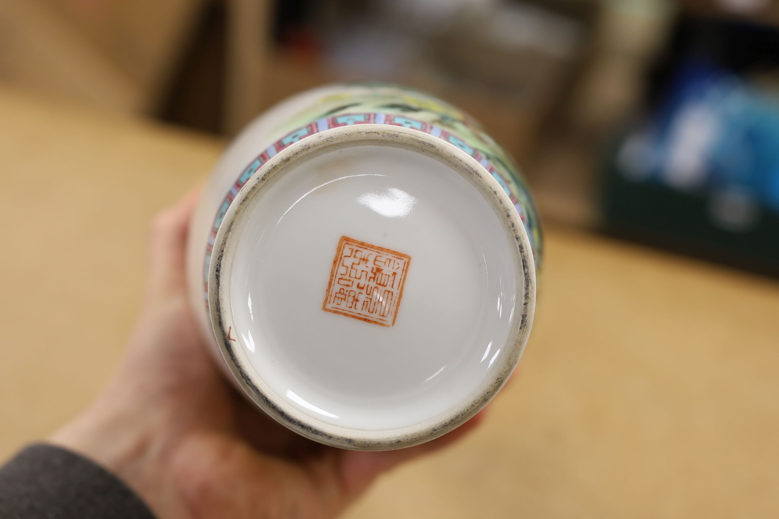 A pair of Chinese famille rose vases decorated with peacocks, 31cm